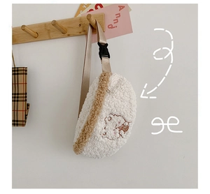 Detail of white sherpa fleece waist bag with cute animal embroidery on wooden hook