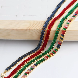 Detailed close-up of rectangular cut colorful zircon tennis necklaces in gold finish