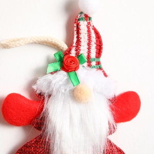 Festive Christmas gnome ornament with red striped hat and white beard for tree decoration