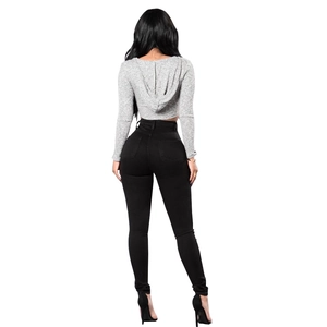 Back view of high-stretch black skinny jeans paired with a gray hooded sweatshirt