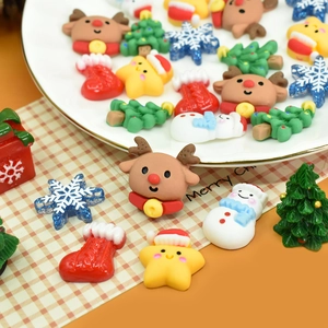 Mix of colorful Christmas resin charms featuring reindeer, snowmen, and trees for DIY crafts
