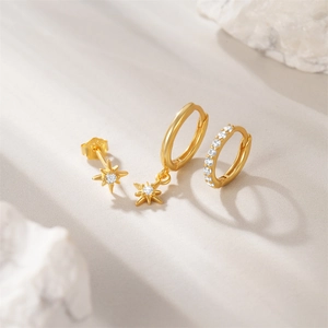 Detail of three-piece S925 gold-plated earring set featuring star studs and zircon hoops