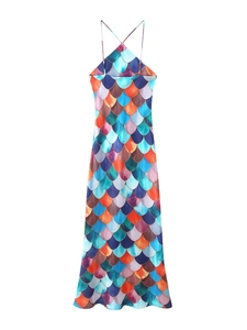 Vertical view of a colorful fish scale print halter maxi dress with backless design