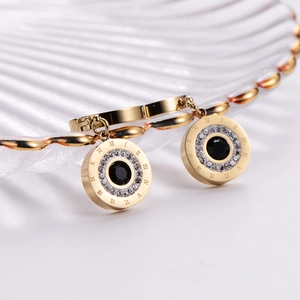 Golden Roman numeral hoop earrings with black stone and sparkling crystal accents
