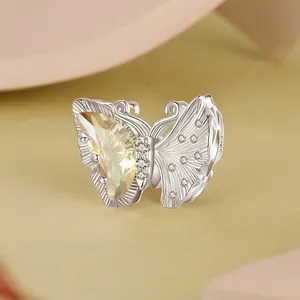 Hollow S925 sterling silver butterfly charm with yellow pear-cut gemstone and zircon