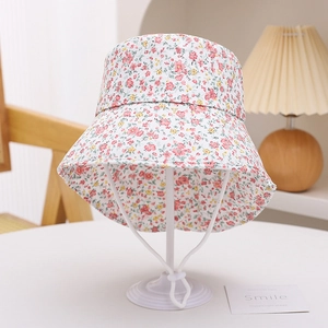 Detail of floral bucket hat for kids with red flowers and adjustable chin strap