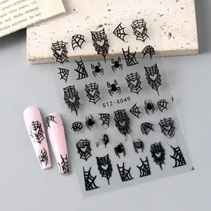 Halloween nail stickers STZ-X049 featuring black spider webs and hearts on pink nails