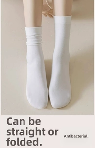 Elastic white cotton socks shown in both straight and slouchy styles for a versatile look