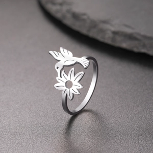 Silver stainless steel ring featuring a delicate hummingbird and flower design in nature style