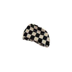 Classic black and white checkered hair claw clip for women in minimalist vintage style