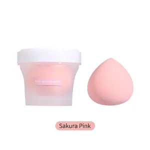 Peach-shaped makeup blender sponge in cherry blossom pink with a clear storage case