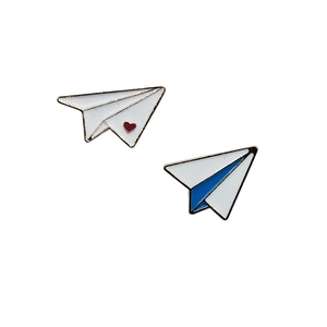 Minimalist paper airplane enamel pins set with red heart and blue accents on metal