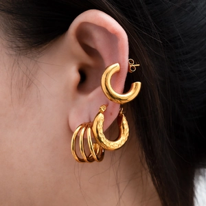 Gold stainless steel hoop earring set featuring smooth and hammered texture designs