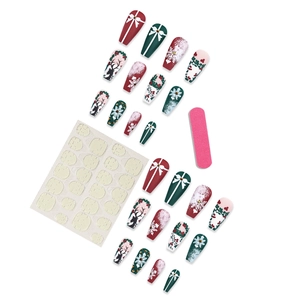 Christmas press-on nail kit with reindeer and snowflake designs including glue and file