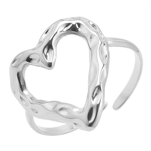 Detailed view of silver heart-shaped open ring featuring unique lava texture and finish
