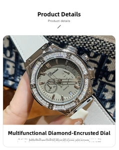 Gros plan d'une montre à quartz pour femme avec lunette en strass