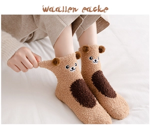 Detailed view of thick coral fleece socks with cute 3D bear ears and embroidery