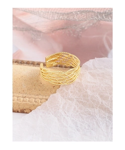 Detailed view of handmade woven texture on gold S925 silver adjustable open ring