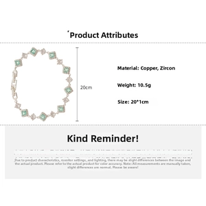 Detail of copper bracelet with green and white cubic zirconia stones and clasp