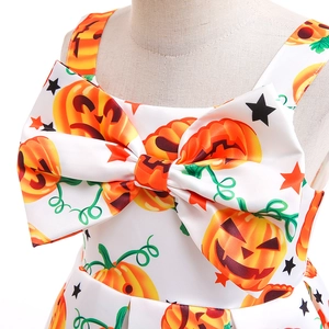 Detail of Halloween pumpkin dress showing the large bow and satin fabric texture