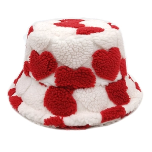 Lambswool bucket hat featuring red heart pattern on white fleece for winter warmth