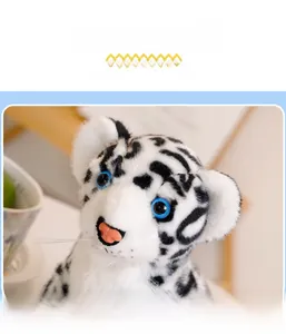 Close-up of plush snow leopard toy featuring realistic blue eyes and soft faux fur texture