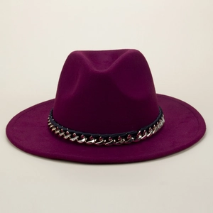 Detailed view of the wine red fedora hat with silver chain and ribbon trim