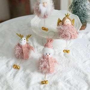 Pink Christmas plush ornaments set with Santa, reindeer and snowman figures on snow