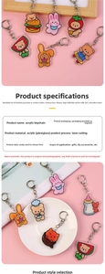 Close-up of laser-cut acrylic keychains featuring cute cartoon bears and rabbits