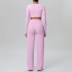 Rear view of a mauve long-sleeved crop top and high-waisted wide-leg sports pants set