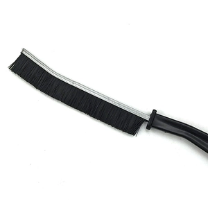Japanese style cleaning brush with black bristles and long plastic handle on white background