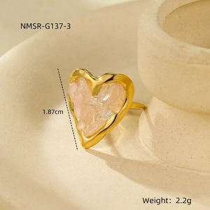 Macro detail of 18K gold-plated heart ring with natural pink stone inlay and dimensions