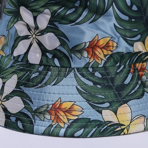 Close-up of tropical floral print bucket hat showing fine stitching and silk-like texture