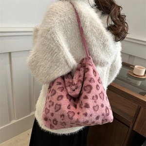 Chic pink faux fur tote bag with heart patterns, oversized plush shoulder bag for women