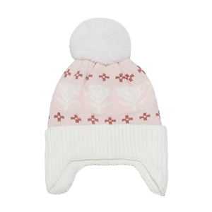 Detailed knit texture of pink winter hat with white floral jacquard and faux fur pompom