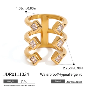 Golden stainless steel cutout ring with square zircons in a modern layered design
