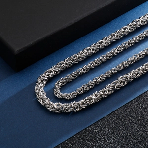 Polished silver Byzantine stainless steel chain necklace for men in a gift box display