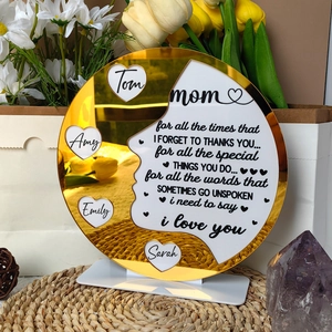 Macro detail of acrylic Mother's Day plaque with gold mirror finish and customized text
