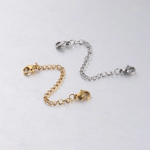 Detail of gold and silver stainless steel extender chains with lobster clasps for jewelry DIY