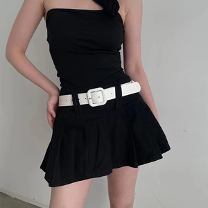 Minimalist black pleated mini skirt featuring a bold wide white belt with a square buckle