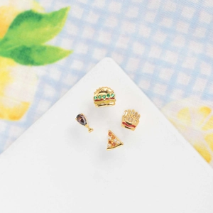 Macro detail of 18K gold plated hamburger and fries stud earrings with colored zircons