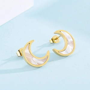 Close-up of golden crescent moon earrings with inlaid white mother of pearl inlay