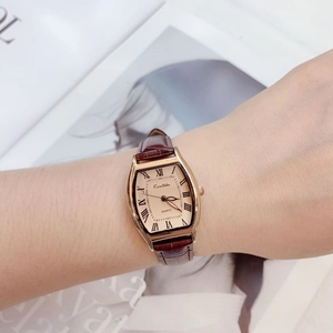 Elegant gold tonneau quartz watch for women with white dial and brown leather strap