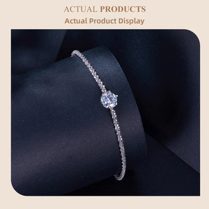 Detailed macro view of S925 silver bracelet featuring a six-prong set moissanite stone