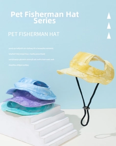 Detail of adjustable pet bucket hats with ear holes and toggle cord in colorful tie-dye patterns