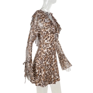 Detail of leopard print mini dress featuring ruffled neckline and tie-up sleeve cuffs