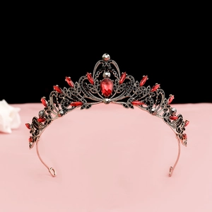 Detailed view of Baroque retro crown with red teardrop crystal and black rhinestones