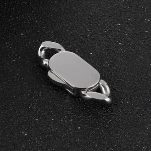 Close-up of polished stainless steel oval lobster clasp on black textured leather