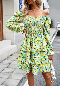 Detail of yellow floral dress with off-shoulder neckline and smocked waist design