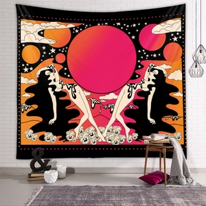 Detail of bohemian pop art tapestry with sun and celestial patterns on white brick wall